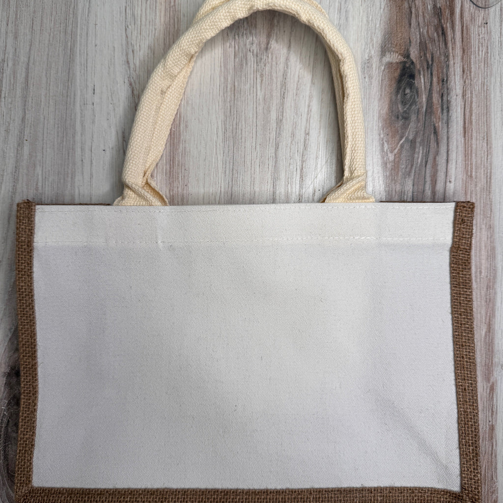 Tote bag with woven handles on a wooden surface